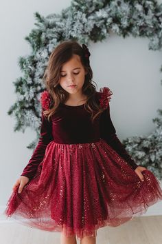 All sales are final for this item. There are no exchanges or returns. ---This season, we're bringing back our bestselling Velour Ballerina Dress in Red Velvet, with new and improved fit (fits truer to size, with more room to grow)! Get ready for some spontaneous twirling with this luxurious dress made of velvet knit and two tiers of gathered tulle and a dash of rose gold pixie dust for some extra magic! Tulle ruffles on the shoulders add a fairy-like touch. The slightly lower dip in in the back Rose Gold Pixie, Red Velvet Skirt, Kids Christmas Dress, Velvet Knit, Luxurious Dress, Tulle Ruffles, Red Holiday Dress, Holiday Dresses Women, Holiday 2024