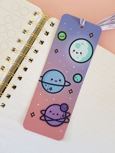 an open notebook with space stickers on it