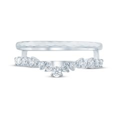 a white gold ring with three diamonds on it