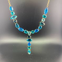 Embrace The Opulent Charm Of Our All Blue Necklace. Composed Of Five Varying Hues Of Reconstituted Blue Stones, This Piece Is Ideal For Any Notable Event. Its Refined Composition Guarantees To Leave An Impression And Elevate Every Ensemble. Encounter The Splendor And Exclusivity Of Our All Blue Necklace. Made Of: Reconstituted Swiss Topaz Reconstituted Sky Topaz Reconstituted London Topaz Reconstituted Apatite Reconstituted Paraiba 18k Gold Plating (10 Microns) Over Brass Made In Brazil Disclaim Blue Gemstone Necklace For Party, Elegant Blue Necklace For Evening, Formal Blue Multi-stone Necklaces, Elegant Blue Multi-stone Necklace, Blue Gemstone Multi-strand Necklaces, Luxury Blue Multi-stone Necklaces, Unique Blue Turquoise Multi-stone Necklace, London Topaz, Apatite Necklace