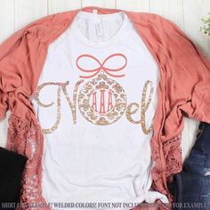 a t - shirt with the word noel on it and a bow at the front