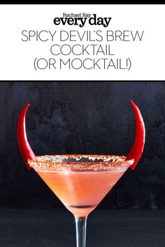 the devil's claw cocktail is served in a martini glass with red horns on it