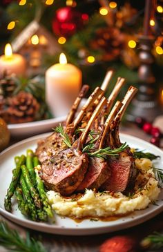 roast beef with mashed potatoes and asparagus on a white plate in front of a lit christmas tree