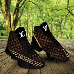 the louis vuitton sneakers are on display in front of a tree filled forest