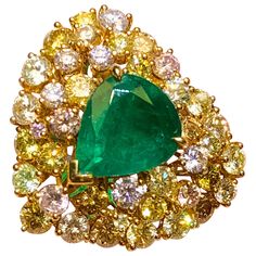 2.8 carat of Vivid Green Emerald with 2.77 carat of natural fancy pink and fancy yellow diamond ring. Fancy Yellow Diamond Ring, Yellow Diamond Ring, Yellow Diamond Rings, Fancy Yellow Diamond, Jewel Colors, Sparkly Jewelry, Emerald Color, Emerald Earrings, European Cut Diamonds