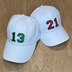 The Kids Biggest Fan Hat is the perfect addition to any game day outfit for your littles! Get it customized with your team's colors and your player's number. THIS IS A YOUTH SIZE HAT. If you are looking for the adult version and don't see it in the shop feel free to message me.  HOW TO ORDER: Pick a color for your number AND a color for the number outline. Choose a white or black felt backing (this is not the hat color, it is the backing the number is embroidered onto for the patch). Then list what number you would like on your hat.  See picture with colors for the corresponding numbers. EX. - 16 for number, 12 for outline. OR 9 for number and outline. Please let me know if you have any questions and I will help make sure you get what you are looking for, I am always here to help! The numb White Sports Fan Hat For Game Day, White Sports Fan Hat For Sporting Events, Sporty White Hats For Game Day, White Sporty Hat For Game Day, White Baseball Cap With Curved Brim For Game Day, White Collegiate Fitted Hat For Game Day, White Trucker Hat With Embroidered Logo For Game Day, White Sports Fan Cap, White Curved Brim Baseball Cap For Game Day