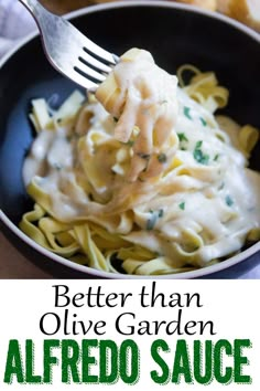 an image of a bowl of alfredo sauce with bread in the background and text overlay that reads better than olive garden alfredo sauce