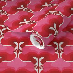 a pink and white wallpaper with an abstract design on the back half of it