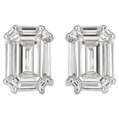 This elegant pair of diamond stud earrings showcases two emerald cut diamonds with a total weight of 0.88ct. They are graded at E-F in color, VS1-VS2 in clarity and measure 7.80 x 5.40mm. They are set in a double prong, 18k white gold setting. Gia Certified Baguette Cut Timeless Diamond Earrings, Modern Emerald Cut Diamond Earrings, White Emerald Cut Diamond Earrings, Classic Platinum Emerald Cut Diamond Earrings, Classic Emerald Cut Platinum Diamond Earrings, Timeless Emerald Cut Diamond Earrings, Emerald Cut White Gold Diamond Earrings, Timeless Emerald-cut Vvs Clarity Diamond Earrings, Timeless Emerald Cut Diamond Earrings With Vvs Clarity