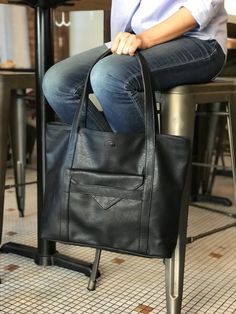 "Vegan leather tote that will elevate any outfit! Flat straps fit comfortably over the shoulder. You will love how roomy it is - big enough for laptop, magazines, water bottle and more. 👜 MATERIALS: - supple vegan leather free of PVC - wood trims 👜 DIMENSIONS: - 13\"H x 17.5\"W x 4.5\"D (33 x 45 x 11.5 cm) - 10\" handle drop (25.5 cm) 👜 DETAILS: - Zippered opening - Front pocket with magnet closure - 3 interior pockets for valuables, phone, sunglasses 👜 COLORS: - espresso, charcoal gray, bla Soft Leather Laptop Bag For Daily Use, Everyday Laptop Shoulder Bag, Laptop Tote Bag Woman, Convertible Tote Bag, Teacher Tote Bag, Tote Bag With Pockets, Vegan Purses, Laptop Tote Bag, Teacher Tote