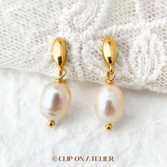 * Style: Minimalist, Classy, Elegant * Material: Gold-plated brass, Freshwater Pearls (natural pearl, each is unique) * Dimension:  Approximate overall length: 2.5 cm-2.8 cm.  * Please note that the size and shape of the pearls vary from pair to pair. *  * ❀ *  * ♥ ♥ How to wear coil pad clip-on earrings?  All you have to do is slip the clip-on onto your earlobe, press the coil pad and it will stay. ❗️❗️For wearing tips, please go to the "About" section, we've filmed a video for how to wear clip Minimalist Drop Hoop Earrings For Wedding, Minimalist Gold Bridal Drop Earrings, Gold Minimalist Teardrop Bridal Earrings, Gold Minimalist Pearl Earrings For Wedding, Oval Gold Hoop Earrings For Wedding, Ear Clips, Earrings Minimalist, Natural Pearl, Pain Free