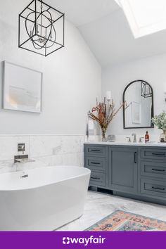 a bathroom with two sinks and a large bathtub in it's center area