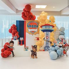 balloons and toys are on display in an office setting for children's birthdays