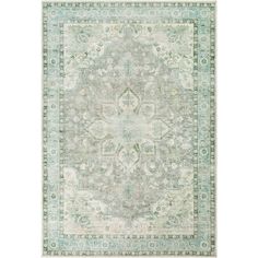 an area rug with green and beige colors