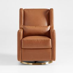 a brown leather chair sitting on top of a white floor