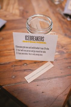 a jar with icebreakers on it sitting on a table next to a piece of paper