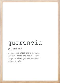 the words querencia written in black and white are displayed on a wooden frame