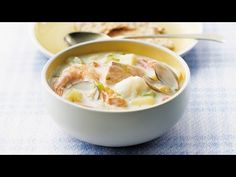 two bowls filled with soup on top of a table