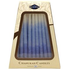 the blue candles are packaged in a cardboard box