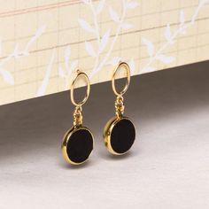 Genuine black onyx circle shape gemstones vermeil gold bezel 14k gold filled posts - Jewelry gifts for mom, wife, aunt, niece, daughter, you Stone: Genuine Black Onyx Bezel: Vermeil Gold Earring, ear-backs and post: 14k Gold Filled Earbacks: Included (14k Gold Filled) Total length of earring: 30mm Circle Gemstone: 12mm diameter About "Gold Filled Jewelry": Also called rolled-gold. These jewelry items are not actually filled with gold. They are made of a base metal covered by sheets of gold in... Post Jewelry, Aunt Niece, Thick Coat, Book Jewelry, Writing Gifts, Black Obsidian, Gold Earring, Circle Shape, Gold Filled Jewelry