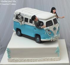 there is a cake that looks like a vw bus with two people and a dog on top