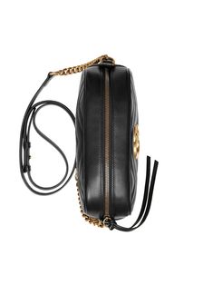 This GG Marmont small matelassé design from Gucci is our-go-to shoulder bag. In classic black, it's wonderfully versatile. Plus its compact design won't weigh you down. Featuring a gold-tone logo plaque, a top zip fastening, a quilted effect and a chain and leather strap. | Gucci GG Marmont small matelassé shoulder bag Gg Marmont Small Matelassé Shoulder Bag, Gg Marmont Small Shoulder Bag, Gucci Store, Gucci Crossbody, Gucci Gg Marmont, Black Leather Crossbody Bag, Gucci Fashion, Chevron Design, Gg Marmont