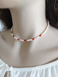 Freshwater pearl and red coral necklace is an excellent and elegant gift for your lovelies.  Summer jewelry is made of freshwater pearl bead, red coral and gold plated apparatus. You can wear the beach accessories to a wedding party and look very special. Freshwater pearl necklace is a nice Christmas gift, Valentine's Day gift, wedding gift, birthday gift, bridesmaid gift and other special day gift for her. Your pearl jewelry will be put in a nice tulle sachette. Red Coral Necklaces For Beach, Red Pearl Necklace With Pearl Charm As Gift, Red Pearl Necklace With Charm As Gift, Red Polished Bead Necklaces For Beach, Handmade Red Coral Pearl Necklace, Red Gemstone Beads Necklaces For The Beach, Red Pearl Necklace With Gemstone Beads, Red Pearl Necklace Gift, Dainty Red Necklace With Tiny Beads