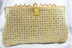 a gold purse with lots of diamonds on it