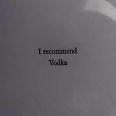 i recommend vodka written on the side of a white refrigerator freezer with black lettering