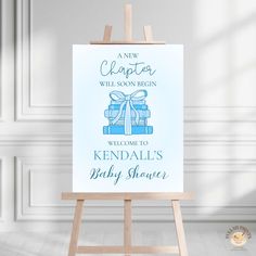 an easel with a welcome sign for a baby shower