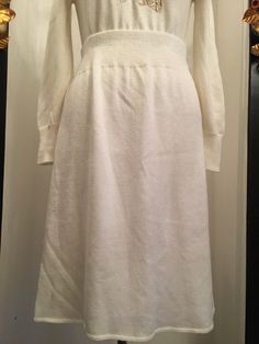 "Vintage 1980s sweater set Trompe l' oeil style Ivory knit skirt and top Gold glitter bow around the neckline Puff shoulders Banded waist and cuffed High waist skirt Elastic waist By Vivanti Very good vintage condition Size medium Bust to 36\" Waist 27-29\" Hips to 42\"" Vintage Solid Sweater With Ribbed Cuffs, Vintage White Sweater With Ribbed Cuffs, 1950ssweaters And Skirts, 80s Skirts, Forenza Sweater 1980s, Vintage Cream Sweater With Button Closure, Asian Style Dress, 80s Skirt, Vintage Dress 60s