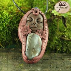 This Clay Goddess Necklace is made from Polymer Clay and a piece of nice quality Botswana Agate and Garnet bead, It comes with a nice gift box( the color of the gift box is in casual ). The Pictures was took by the natural Daylight.   Item Description: S/N :                     GA03512 WEIGHT :            32g (1g= 5 Ct) SIZE:                    70x35x17mm( 1 inch =25.4mm) QTY:     �            1 PCS Drilling :            Whole hole Terms of Policy 1.Please email us if you have any questions We wi Clay Goddess, Goddess Pendant, Goddess Necklace, Botswana Agate, Clay Necklace, Handcrafted Necklace, Handmade Clay, Handmade Pendant, Agate Beads