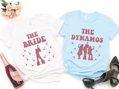 two t - shirts that say the bride and the dymos