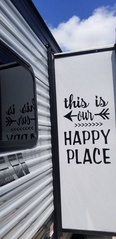 this is our happy place sign in front of a trailer