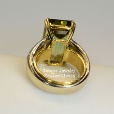 Rare bi-color green yellow tourmaline 18k white and yellow gold diamond vintage ring! The tourmaline is a rare bi-color green and yellow and has a different look depending on the viewing angle! The band is set with 40 white round diamonds totaling .8 carats. Ring Size: 6.5 Total Weight: 18.3 grams Precious Metal: 18k white and yellow gold Precious stones: -Green Yellow Bi-color Tourmaline center stone: 16.98 carats, 18.8mmx11mm -White Round Diamonds: 0.8 carats, QTY 40 Hallmark: 750 Luxury Gold Tourmaline Rings, Formal Yellow Gold Emerald Ring, Formal Gold Jewelry With Tourmaline, Formal Yellow Gold Tourmaline Jewelry, Formal Gold Tourmaline Jewelry, Polished Tourmaline Jewelry For Anniversary, Gold Tourmaline Ring In Fine Jewelry Style, Gold Tourmaline Ring Fine Jewelry, Gold Tourmaline Jewelry With Center Stone