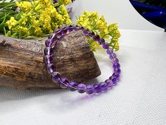 You will love this Amethyst Bracelet Adjustable, each bead is to give you strength whether its for you or someone you love. So consider my natural purple amethyst healing gemstone grade AAAAA 6mm beads bracelets as part of a well-balanced wardrobe. Natural Amethyst Bracelet, Amethyst Gemstone Healing Bracelet, Amethyst Bracelet, Energy Healing BraceletMEASURE YOUR WRIST:- Measure around at the wrist bone in tape or even a strip of paper.- Choose a place where you would normally wear a bracelet. Hand-strung Amethyst Stretch Bracelet, Purple Amethyst Beaded Bracelets As Gift, Purple Gemstone Beads Stretch Bracelet, Purple Crystal Bracelet With 8mm Beads As A Gift, Purple Crystal Bracelet With Natural Stones As Gift, Purple Hand-strung Stretch Bracelet As Gift, Spiritual Amethyst Bracelet With 8mm Beads, Adjustable Amethyst Round Bead Crystals, Spiritual Amethyst Crystal Bracelet With 8mm Beads