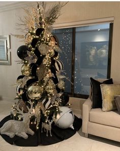 a christmas tree decorated with black and white ornaments