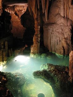 the inside of a cave filled with water