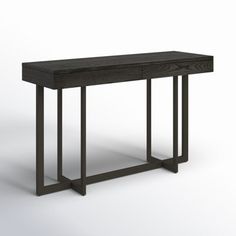 a wooden table with metal legs and a black finish on the top, against a white background