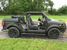 the jeep is parked on the side of the road in the parking lot with its door open