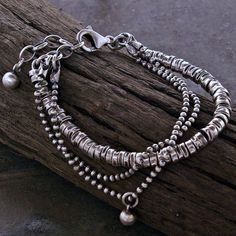 A beaded bracelet handmade of oxidized sterling silver. APPROXIMATE MEASUREMENTS: * Total length: 18 cm/19 cm/20cm/21cm + 3 cm adjustable chain  or  7"/7.5"/8"/8.5" + 1.2" extra chain  * Beaded size (diameter) : ~4 mm  * Metal : 925 sterling silver The bracelet pictured are not the exact ones that you will receive, but it will be the same design. S H I P P I N G : If you need things for special occasions or by a certain date please ensure that you order in plenty of time as the postal system is Rhodonite Bracelet, Modern Geometric Jewelry, Boho Charm Bracelet, Oxidized Silver Bracelet, African Turquoise Bracelet, Multi Chain Bracelet, Raw Stone Earring, Pink Rhodonite, Silver Beaded Bracelet