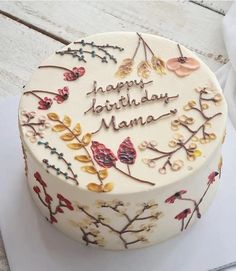 a decorated birthday cake sitting on top of a table