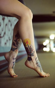 a woman's legs with tattoos on them are shown in this instagramtion