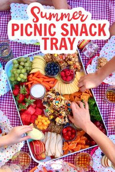 people are eating picnic snacks on a blanket with the words, summer picnic snack tray