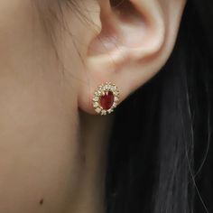 Add A Touch Of Elegance To Any Outfit With Our Delicate Earring Studs, Crafted With Lab Grown Diamonds And Beautiful Oval Cut Rubies. Elegant Oval Diamond Earrings With 17 Jewels, Red Oval Diamond Earrings For Anniversary, Oval Red Diamond Earrings For Anniversary, Elegant Red Oval Diamond Earrings, Oval Halo Design Bridal Earrings For Formal Occasions, Oval Halo Bridal Earrings For Formal Occasions, Exquisite Oval Diamond Earrings For Anniversary, Formal Oval Diamond Earrings With Gemstones, Elegant Oval Diamond Earrings With Gemstones