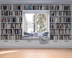 a window seat in front of a bookcase filled with books