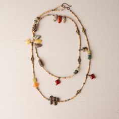 Beachy 38" Necklace 38" single-strand beaded necklace is composed of Mali clay beads, assorted agates, aquamarine,  smoky quartz, prehnite, peridot, carnelian, brass beads, and more.  GIFTABLE A jewelry gift pouch is included. The pouch will differ from the one photographed. A representative sample is shown. SIZE Necklace 38" adjustable (shown doubled) This necklace is shown nested inside the 40" necklace in the group photo. COORDINATING PIECES Turquoise Blue Ashanti Earrings... https://www.etsy.com/listing/1715080888/ashanti-and-mali-clay-bead-earrings?ref=listings_manager_table Seaglass Green Ashanti Earrings... https://www.etsy.com/listing/1715083070/ashanti-and-mali-clay-bead-earrings?ref=listings_manager_table Necklace 40"... https://www.etsy.com/listing/1715075458/neutral-necklace-40 Bohemian Single Strand Lariat Beads, Adjustable Long Gemstone Beads Necklace, Bohemian Single Strand Beaded Necklaces For Layering, Adjustable Gemstone Beads Long Necklace For Healing, Long Beaded Necklace With Gemstone Beads For Layering, Adjustable Double Strand Gemstone Beads Long Necklace, Adjustable Double Strand Long Necklace With Gemstone Beads, Bohemian Long Necklace With Natural Stones For Layering, Bohemian Long Necklace With Round Beads For Layering