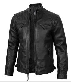 A men's black cafe racer biker leather jacket typically features a sleek, minimalist design that is iconic in motorcycle culture. It often includes: Material: Genuine leather (sometimes faux leather) for durability and style. Color: Black is the most common color, offering a classic and versatile look. Style: Cafe racer style characterized by a fitted cut, snap collar, and sometimes quilted shoulders or elbows for added protection and style. Details: Zippered cuffs, multiple pockets (often with Fitted Black Cafe Racer Leather Jacket, Black Fitted Cafe Racer Leather Jacket, Black Cafe Racer Leather Jacket With Long Sleeves, Fitted Black Cafe Racer Outerwear, Black Leather Cafe Racer Outerwear, Black Cafe Racer Biker Jacket, Black Leather Cafe Racer Jacket For Motorcycling, Black Cafe Racer Leather Jacket For Streetwear, Black Cafe Racer Leather Jacket For Biker Events