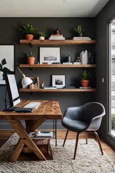 a home office with black walls, shelves and plants on the shelf above the desk