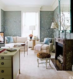 a living room filled with furniture and a flat screen tv sitting on top of a table